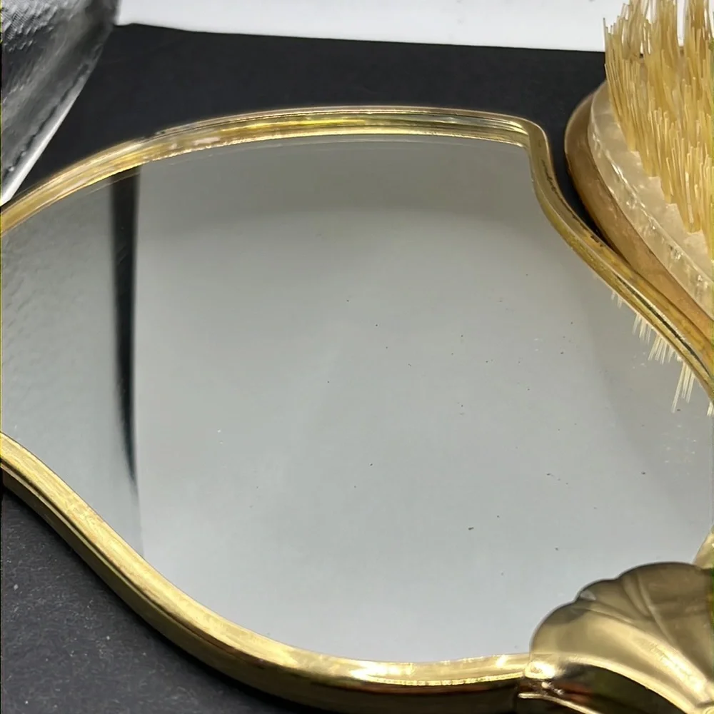 Vintage vanity hand mirror and brush